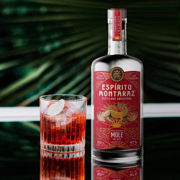 Bottle of our mezcal and a Mezcal Cocktail made with Pechuga de Mole Ancestral Mezcal Espiritu Montaraz